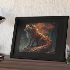 May include: A framed print of a fantasy fox with orange and brown fur, surrounded by autumn leaves. The fox is sitting on a rock in a forest setting.