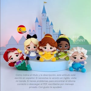 May include: A collection of six crocheted dolls, each representing a Disney princess. The dolls are in various colors, including red, blue, yellow, green, and white. A castle backdrop is visible behind the dolls. The dolls are handmade.