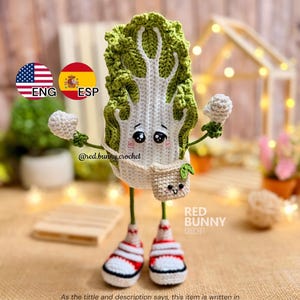 May include: A crocheted napa cabbage character with green and white leaves, a smiling face, and black eyes. It wears a small beige bag with a face, green arms with white hands, and red and white sneakers. Text includes @red.bunny.crochet and RED BUNNY CROCHET.