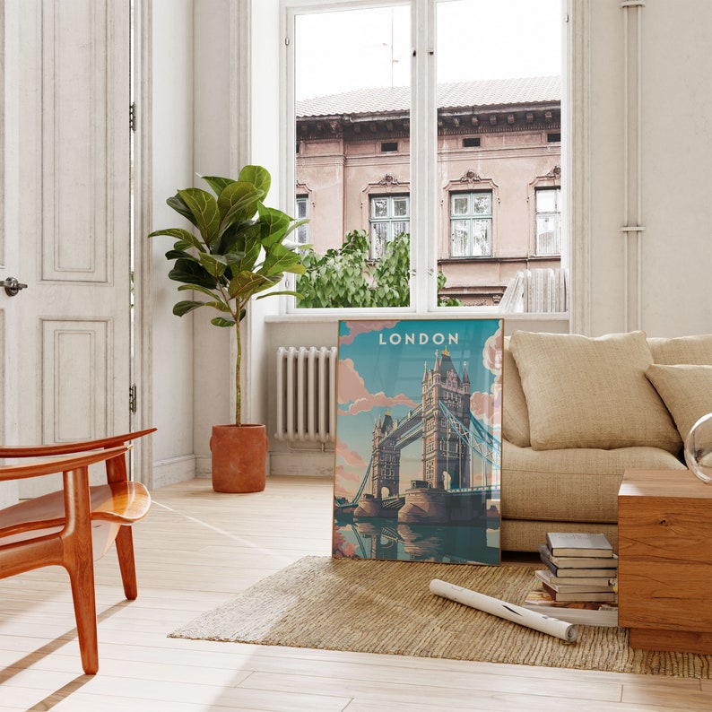 May include: A vintage-style poster with a blue sky and pink clouds, featuring a view of the Tower Bridge in London. The poster has the word "LONDON" printed in white at the top.