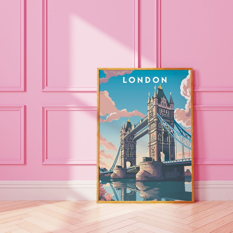 May include: A vintage-style poster with a gold frame featuring a colorful illustration of Tower Bridge in London, England. The poster has the word "LONDON" in white text at the top.