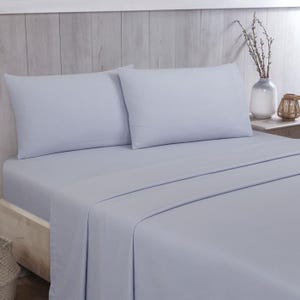 May include: A pale blue bed linen set, comprising a fitted sheet, a flat sheet, and two pillowcases. The bedding is arranged on a bed, with a neutral wooden headboard in the background. The sheets appear soft and smooth, ideal for a bedroom.