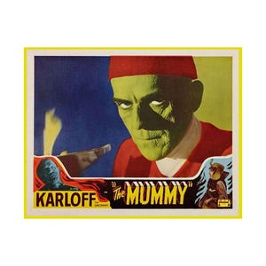 May include: A vintage movie poster for "The Mummy" starring Boris Karloff. The poster has a yellow border and shows a green-skinned mummy wearing a red headdress. The film's title and the actor's name are clearly visible.