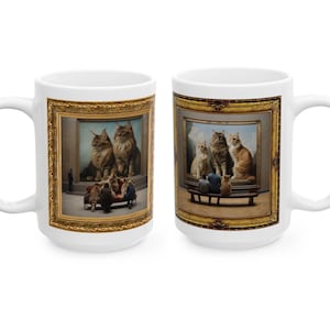 May include: Two white ceramic mugs with a gold-framed image of cats in a museum setting. The mug on the left shows two large cats in a painting, while the mug on the right shows three cats in a painting.
