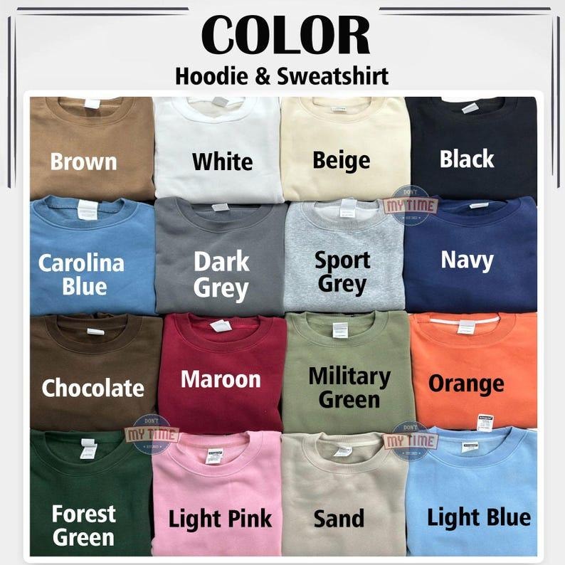 May include: A display of various colored hoodies and sweatshirts. Colors include brown, white, beige, black, Carolina blue, dark grey, sport grey, navy, chocolate, maroon, military green, orange, forest green, light pink, sand, and light blue. The text "COLOR Hoodie & Sweatshirt" is at the top.