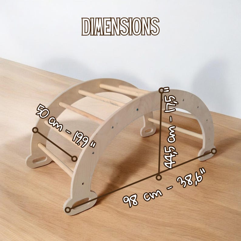 May include: A wooden climbing arch with dimensions displayed. The arch measures 98 cm long, 50 cm wide, and 44.5 cm tall. The text "DIMENSIONS" is at the top. The arch features several wooden rungs for climbing.
