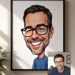 May include: A framed caricature illustration of a person with dark hair, a beard, and black-rimmed glasses, wearing a blue shirt. The artwork is displayed alongside a smaller, original photographic reference of the same person in a blue shirt.