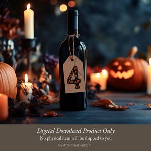 May include: A bottle of red wine with a Halloween-themed tag that says "4" on it. The bottle is surrounded by pumpkins, candles, and fall leaves.