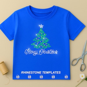 May include: A bright blue short-sleeved t-shirt featuring a green rhinestone Christmas tree graphic with a star on top and the text Merry Christmas in white rhinestones. Below the text, the words RHINESTONE TEMPLATES appear with five file format icons.