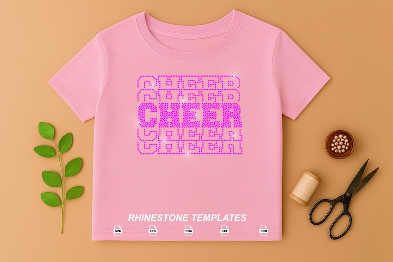 May include: A light pink short-sleeved t-shirt featuring the word CHEER repeated five times in a stacked, block-letter design made of bright pink rhinestones. The text RHINESTONE TEMPLATES appears at the bottom with five small file format icons.