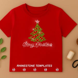 May include: A bright red short-sleeved t-shirt featuring a green and yellow rhinestone Christmas tree graphic with a star topper and the text Merry Christmas in white rhinestones. The bottom includes the text RHINESTONE TEMPLATES.