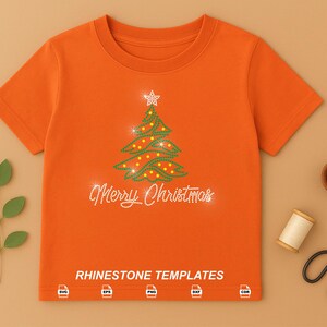May include: An orange short-sleeved t-shirt featuring a rhinestone Christmas tree graphic with a star topper and the text Merry Christmas. The bottom includes the text RHINESTONE TEMPLATES and five file format icons.