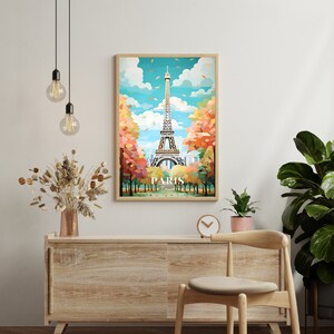 May include: A colorful illustration of the Eiffel Tower in Paris, France. The tower is surrounded by trees with fall foliage. The image is framed in a light wood frame.