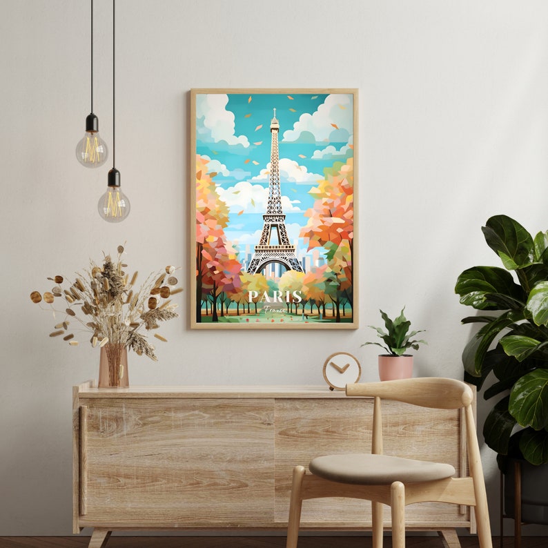 May include: A colorful illustration of the Eiffel Tower in Paris, France. The tower is surrounded by trees with fall foliage. The image is framed in a light wood frame.