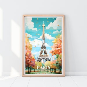 May include: A framed illustration of the Eiffel Tower in Paris, France. The tower is depicted in a geometric style with a blue sky and white clouds in the background. The trees in the foreground are a mix of orange, yellow, and red.