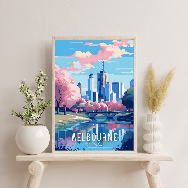 May include: A colorful illustration of the Melbourne skyline with a bridge and river in the foreground. The city is depicted with tall buildings and a pink sky with clouds. The text "MELBOURNE - Australia" is at the bottom of the image.