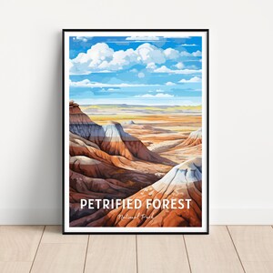 May include: A colorful illustration of the Petrified Forest National Park in Arizona. The image shows a landscape of colorful rock formations with a blue sky and white clouds in the background. The text "Petrified Forest National Park" is at the bottom of the image.