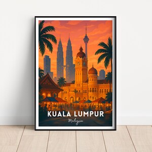 May include: A framed art print of Kuala Lumpur, Malaysia, featuring iconic landmarks like the Petronas Towers and the KL Tower. The artwork showcases a vibrant sunset with palm trees and the text "Kuala Lumpur Malaysia".