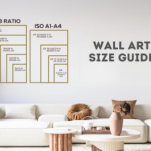 May include: A wall art size guide with two columns of different size ratios. The left column is labeled "2:3 Ratio" and shows the dimensions in inches and centimeters for five different sizes. The right column is labeled "ISO A1-A4" and shows the dimensions in inches and centimeters for four different sizes. The text "WALL ART SIZE GUIDE" is at the top of the image.