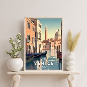 May include: A vintage travel poster featuring a colorful illustration of a canal in Venice, Italy. Gondolas are docked along the canal, with buildings lining the water's edge. The text "VENICE Italy" is at the bottom of the poster.