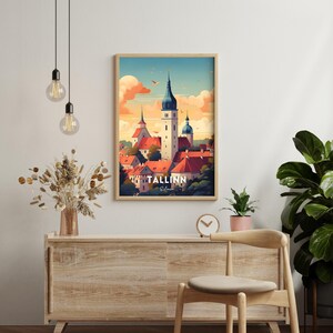 May include: A framed poster with a colorful illustration of the city of Tallinn, Estonia. The poster features a cityscape with buildings and a church steeple. The text "TALLINN, Estonia" is printed at the bottom of the poster.