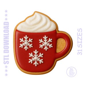 May include: A gingerbread cookie in the shape of a red mug with white snowflake decorations and whipped cream topping. The cookie has a golden-brown outline and handle. Text on the image reads "STL DOWNLOAD" and "31 SIZES".