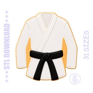 May include: A white karate uniform with a black belt, designed as a cookie cutter. The design includes the text "STL DOWNLOAD" and "31 SIZES". The Little Cutting Shop logo is also visible.