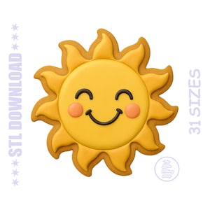 May include: A yellow sun-shaped cookie cutter with a smiling face, featuring curved rays, pink cheeks, and a dark brown mouth. The text reads STL DOWNLOAD and 31 SIZES, with a circular logo for The Little Cutting Shop in the bottom right corner.