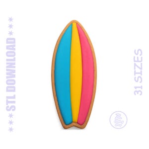 May include: A surfboard-shaped cookie decorated with smooth icing in vertical stripes of bright blue, yellow, and pink. The text STL DOWNLOAD and 31 SIZES appears on the sides, with a circular logo for The Little Cutting Shop at the bottom.