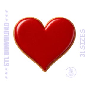 May include: A red heart-shaped cookie cutter with a glossy finish and a golden-brown edge. The image includes the text "STL DOWNLOAD" and "31 SIZES" in a light purple color. A small logo is visible.