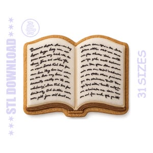 May include: A cookie in the shape of an open book with white icing pages and brown edges. The pages are decorated with black icing to resemble handwritten text. The text "STL DOWNLOAD" and "31 SIZES" are visible.