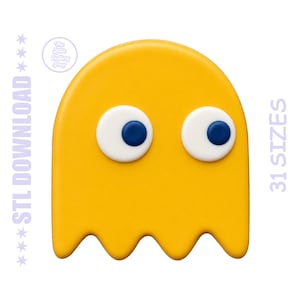 Puede incluir: Un diseño amarillo en forma de fantasma con ojos blancos y azules. La imagen incluye el texto "STL DOWNLOAD" a la izquierda y "31 TAMAÑOS" a la derecha. Un pequeño logotipo está en la esquina superior izquierda.