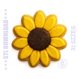 May include: A sunflower-shaped cookie cutter with yellow petals and a dark brown center. The cookie cutter has the text "STL DOWNLOAD" and "31 SIZES" in purple. The Little Cutting Shop logo is also visible.