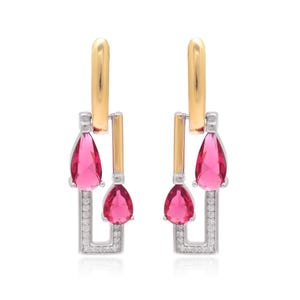 May include: A pair of gold and silver earrings with a rectangular design. Each earring features a gold top, a silver rectangular frame with small clear stones, and two teardrop-shaped, bright pink gemstones.