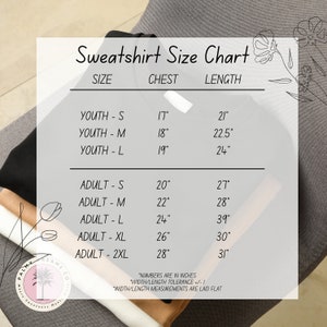 a women's sweatsuit size chart on a chair