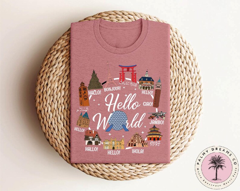 a pink t - shirt with the words hello world on it