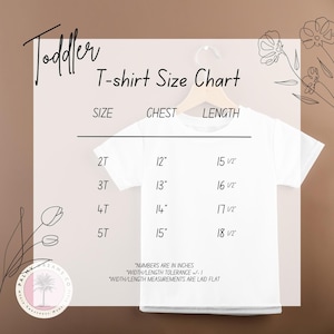 a toddler's t - shirt size chart on a hanger
