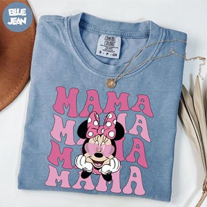 a blue shirt with a minnie mouse on it