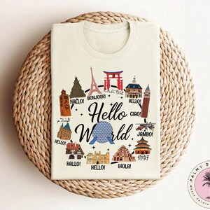 a white t - shirt with the words hello world printed on it