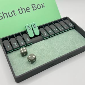 Shut The Box - 12-player. Historical dice game, pub game, travel game for 1 to 4 players. Luck and strategy. Dice Board Travel Game Green