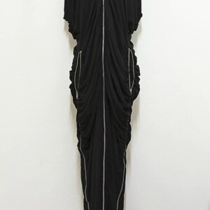 May include: A rustic wooden sign with the text "Welcome" in a handwritten style. The sign is painted white with a distressed finish, and a small, decorative heart is attached to the bottom. The background is a blurred image of a wooden surface.