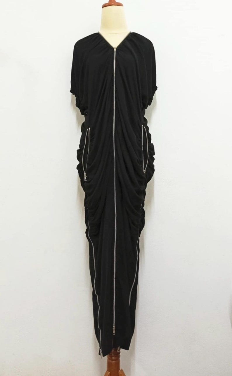 May include: A rustic wooden sign with the text "Welcome" in a handwritten style. The sign is painted white with a distressed finish, and a small, decorative heart is attached to the bottom. The background is a blurred image of a wooden surface.