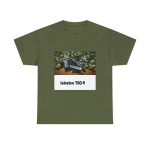 May include: A green t-shirt with a white rectangle featuring a black and silver Intratec TEC-9 pistol on a camouflage background. The text "Intratec TEC-9" is printed in black on the white rectangle.