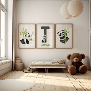 May include: Three framed prints with a watercolor illustration of a panda bear and bamboo. The middle print has the letter T and the name TOMMY written below it.