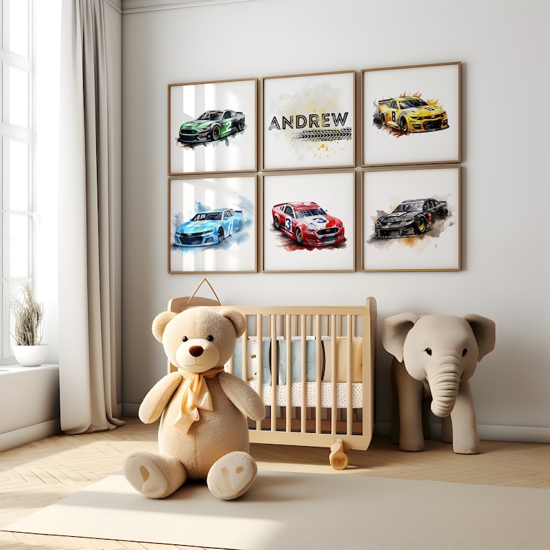 May include: A nursery room with a crib, a teddy bear, and an elephant toy. There are six framed watercolor paintings on the wall, each featuring a different race car. One of the paintings has the name "ANDREW" written on it.