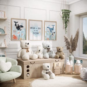 May include: A nursery scene with framed artwork depicting marine life and the phrase "Dream as big as the ocean." Several teddy bears are arranged on a wooden chest. A mint green armchair and hanging plants add to the room's decor.