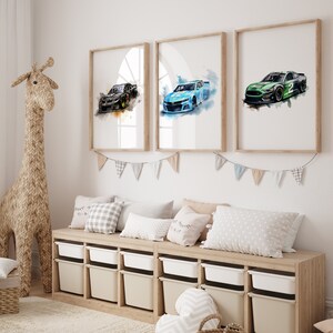May include: Three framed watercolor paintings of race cars. The cars are a black, blue, and green. The paintings are hung on a white wall above a wooden bench with pillows.
