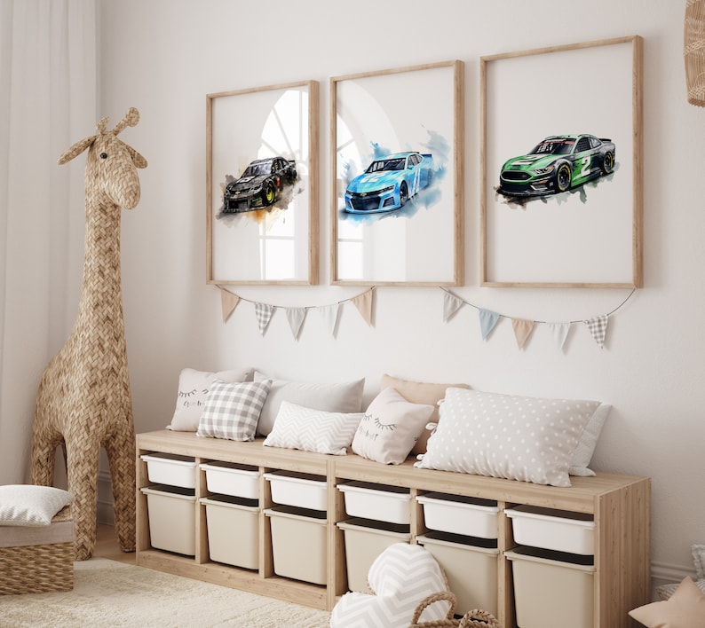 May include: Three framed watercolor paintings of race cars. The cars are a black, blue, and green. The paintings are hung on a white wall above a wooden bench with pillows.