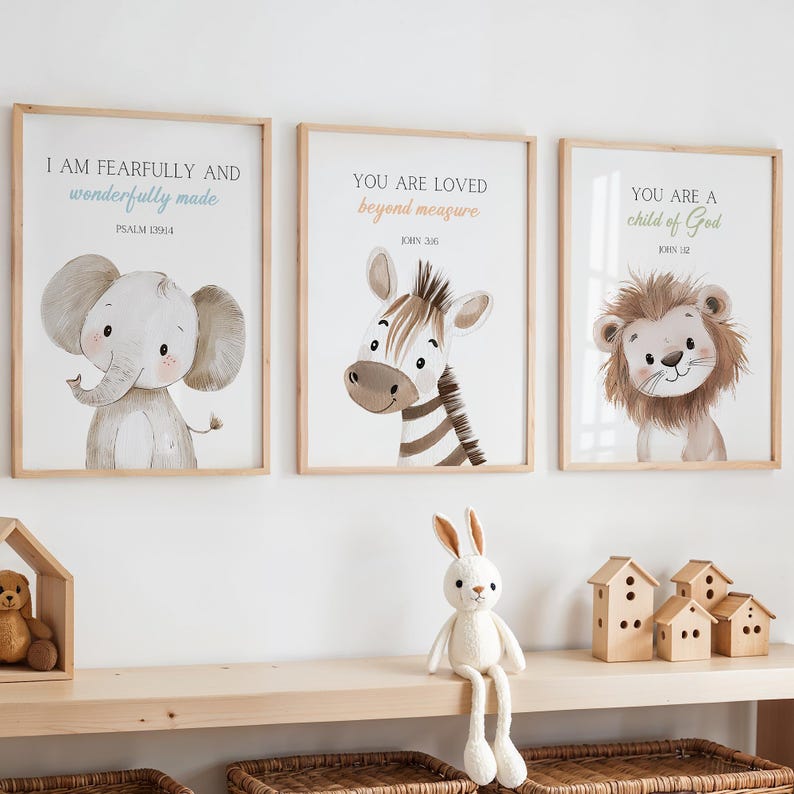 May include: Three framed prints with inspirational quotes and cute animal illustrations. The prints feature an elephant, a zebra, and a lion. The quotes are "I am fearfully and wonderfully made", "You are loved beyond measure", and "You are a child of God".