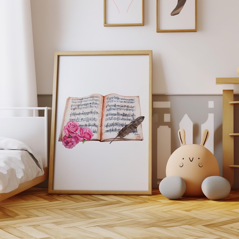 May include: A watercolor painting of an open book with musical notes, a feather quill, and pink roses. The book is on a white background.